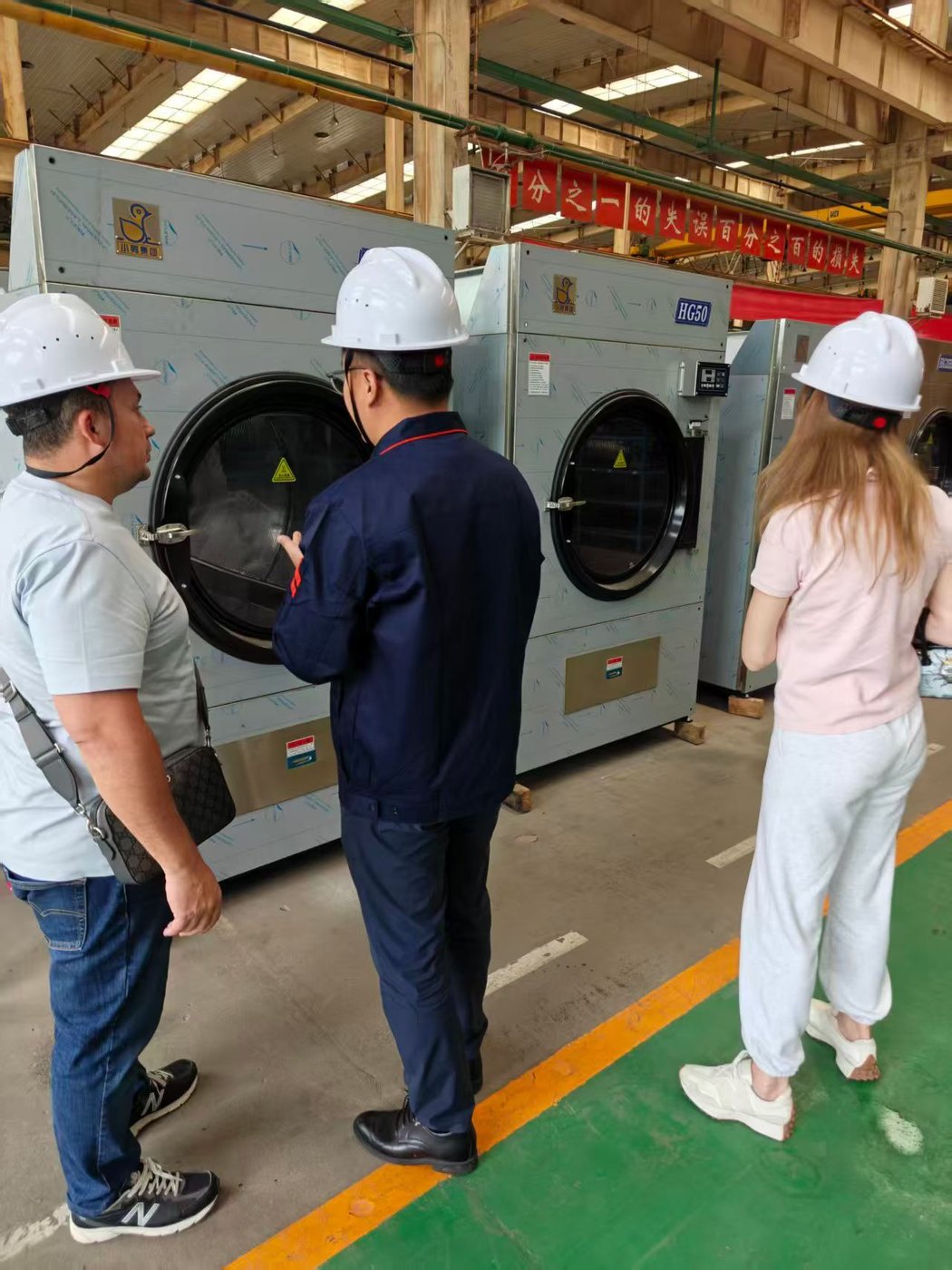 Customer visiting XIAOYA laundry equipment factory